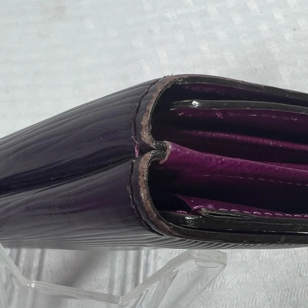 1136: Louis Vuitton Epi Leather Trifold Wallet Purple